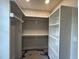 Spacious walk-in closet featuring custom shelving and a clothing rod at 318 Deer Tail Ln # 35, Fuquay Varina, NC 27526