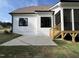 New construction home featuring a screened in porch with wooden steps and a concrete patio at 318 Deer Tail Ln # 35, Fuquay Varina, NC 27526