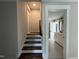 Staircase leading to a bathroom with a double vanity and gray tile at 318 Deer Tail Ln # 35, Fuquay Varina, NC 27526