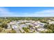 Expansive aerial view of a charming town, showcasing mature trees and a blend of residential and commercial buildings at 326 Lake Dr, Wendell, NC 27591
