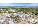 An aerial view of city buildings featuring roads, parking, and lots of trees at 326 Lake Dr, Wendell, NC 27591
