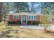 Charming brick home with a well-maintained lawn and inviting front porch at 326 Lake Dr, Wendell, NC 27591