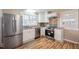 Modern kitchen with stainless steel appliances and bright white cabinets at 326 Lake Dr, Wendell, NC 27591