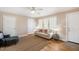 Bright living room with hardwood floors and a cozy couch near sunlit windows at 326 Lake Dr, Wendell, NC 27591