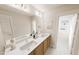 Elegant bathroom featuring double sinks, modern fixtures, and a large mirror for a bright, spacious feel at 3930 Willow Gate Way, Raleigh, NC 27604
