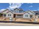 Newly constructed, two-story homes with a modern design and inviting front entrances under a blue sky at 3930 Willow Gate Way, Raleigh, NC 27604