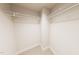 A walk-in closet features white shelving and neutral carpet at 3930 Willow Gate Way, Raleigh, NC 27604
