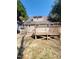 Back of the house with a wooden deck overlooking the spacious, treelined backyard at 4204 Labrador Dr, Raleigh, NC 27616