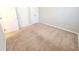 An adaptable bedroom with neutral walls, carpet, and plentiful closet space at 4204 Labrador Dr, Raleigh, NC 27616