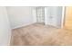 Bedroom featuring neutral carpet, light walls, closet, and white doors at 4204 Labrador Dr, Raleigh, NC 27616