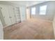 Bedroom featuring neutral carpet, light walls, closet, and white doors at 4204 Labrador Dr, Raleigh, NC 27616