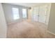 Spacious bedroom featuring a closet, neutral walls, carpet and windows to let in natural light at 4204 Labrador Dr, Raleigh, NC 27616