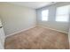 Bedroom with cozy carpet, natural light, and a neutral paint color at 4204 Labrador Dr, Raleigh, NC 27616