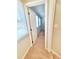 Hallway with neutral walls, carpet, white trim, and natural light from windows at 4204 Labrador Dr, Raleigh, NC 27616