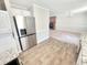 Modern kitchen seamlessly connected to the living area, featuring stainless steel appliances and sleek countertops at 4204 Labrador Dr, Raleigh, NC 27616