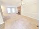 Bright and airy living room with traditional design elements, including a brick fireplace and plush carpet at 4204 Labrador Dr, Raleigh, NC 27616
