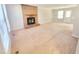 Spacious living room featuring a brick fireplace, and a door for easy outdoor access at 4204 Labrador Dr, Raleigh, NC 27616