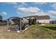 Spacious backyard features a pergola, lush lawn, and ample space for outdoor activities at 47 London Ln, Angier, NC 27501