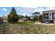 Large backyard with grassy space and mature trees, perfect for recreation and relaxation at 47 London Ln, Angier, NC 27501