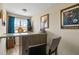 Cozy bar area featuring unique decor, countertop seating, and natural light from the window at 47 London Ln, Angier, NC 27501