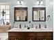 Bathroom features a double vanity, framed mirrors, and plenty of counter space at 47 London Ln, Angier, NC 27501