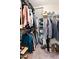 Walk-in closet with hanging racks, shelving, and ample storage space for clothing and accessories at 47 London Ln, Angier, NC 27501