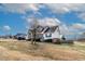 Inviting single Gathering home showcasing a cozy front porch, mature trees, and a serene pond in the backyard at 47 London Ln, Angier, NC 27501