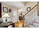 Welcoming foyer with hardwood floors, staircase, and view into the dining room at 47 London Ln, Angier, NC 27501