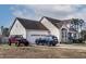 Spacious suburban home boasting an attached garage and a convenient driveway with parking for multiple vehicles at 47 London Ln, Angier, NC 27501