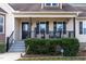 Covered front porch with decorative touches, creating a welcoming atmosphere at 47 London Ln, Angier, NC 27501