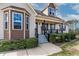 Charming front porch with manicured landscaping and inviting entrance to the home at 47 London Ln, Angier, NC 27501