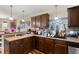 Well-lit kitchen features warm wood cabinets, countertops, and stainless steel appliances at 47 London Ln, Angier, NC 27501