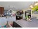 Open kitchen with dark cabinetry, breakfast bar, and hardwood floors at 47 London Ln, Angier, NC 27501