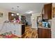Spacious kitchen with dark wood cabinets and hardwood floors at 47 London Ln, Angier, NC 27501