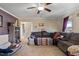 A cozy living room showcases a brown sectional couch and natural light at 47 London Ln, Angier, NC 27501