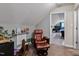 Reading nook with comfortable chair, rocking horse, and books at 47 London Ln, Angier, NC 27501