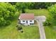 Aerial view of home with mature landscaping, and an expansive driveway at 524 N Occoneechee St, Hillsborough, NC 27278