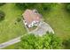 An aerial view of the home with a long driveway and showing the roofline at 524 N Occoneechee St, Hillsborough, NC 27278