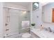 Clean bathroom features a shower-tub combo, marble sink, and natural light at 524 N Occoneechee St, Hillsborough, NC 27278
