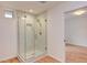 Modern bathroom with glass shower door, tiled walls, and updated fixtures at 524 N Occoneechee St, Hillsborough, NC 27278