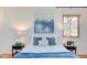 Charming bedroom with cozy pillows, bedside tables and natural light at 524 N Occoneechee St, Hillsborough, NC 27278