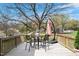 Inviting deck with table and chairs, perfect for enjoying the outdoors and scenic views at 524 N Occoneechee St, Hillsborough, NC 27278