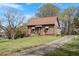 Cozy home featuring a well-maintained lawn and inviting entrance, adding to its curb appeal at 524 N Occoneechee St, Hillsborough, NC 27278