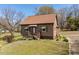Delightful home showcasing a classic design and manicured lawn, creating an inviting outdoor ambiance at 524 N Occoneechee St, Hillsborough, NC 27278