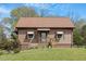 Charming single-story home with a well-maintained lawn and cozy front porch at 524 N Occoneechee St, Hillsborough, NC 27278