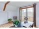 Bright office space with wood floors, exposed beams, balcony and seating at 524 N Occoneechee St, Hillsborough, NC 27278