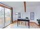 Sunlit office space with wood floors, exposed beams, and a walk out balcony at 524 N Occoneechee St, Hillsborough, NC 27278