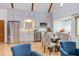Bright kitchen featuring modern appliances, grey cabinetry, and a glass dining table with upholstered chairs at 524 N Occoneechee St, Hillsborough, NC 27278