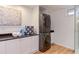 Updated laundry area featuring a full-size washer and dryer and storage at 524 N Occoneechee St, Hillsborough, NC 27278