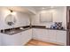 Bright laundry room with white cabinets, modern fixtures, and clean design at 524 N Occoneechee St, Hillsborough, NC 27278